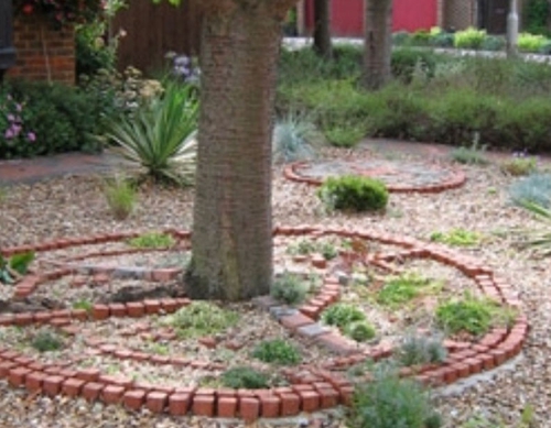 Blockwork feature tree surround.