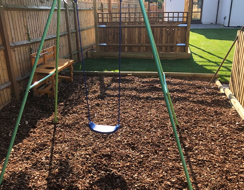 Discreet play area in private back garden.