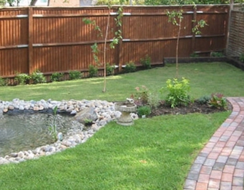 New landscaped turfed garden with boudary fencing.