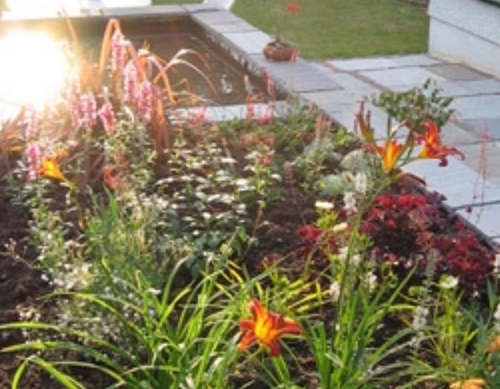 Raised flower beds and paved garden.